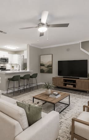 an open kitchen with a granite counter top and stools
