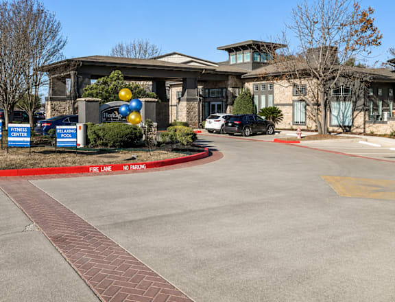 A gym with a sign that says Fitness and a pool is shown.