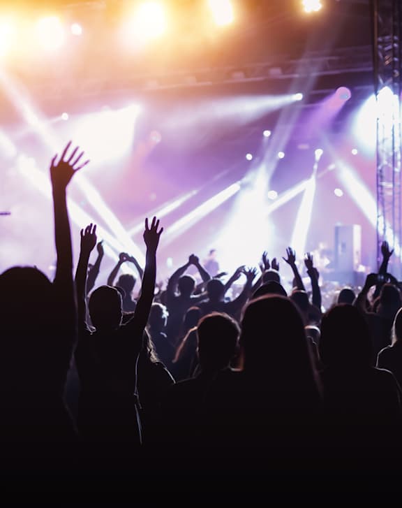 A crowd of people at a concert with their hands raised in the air. at Life At Agora Apartments, Cleveland, Ohio