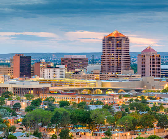 a view of the salt lake city skyline at dusk at Acacia Gardens, Albuquerque, New Mexico
