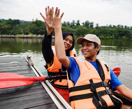 a man and a woman in a canoe on a lake at Village at Terra Bella Apartments, Land O' Lakes, Florida