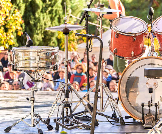 a drum set on a stage in front of a crowd at Monterey Ranch, Austin, TX, 78749