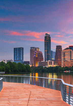 a view of the minneapolis skyline from the riverfront boardwalk