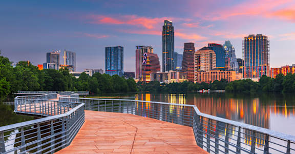 a view of the minneapolis skyline from the riverfront boardwalk