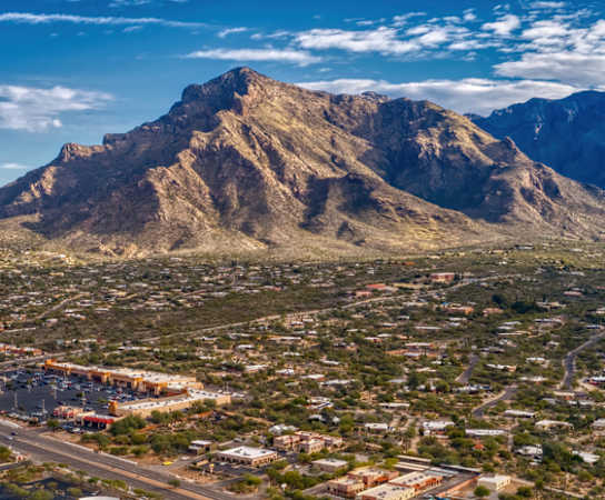 Arial view of a city with a mountain in the background at Villas at San Dorado, Arizona
