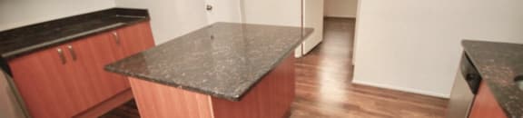 Tons of cabinet space and rich flooring