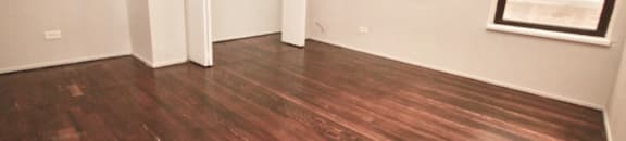 Bedroom with hard-wood flooring