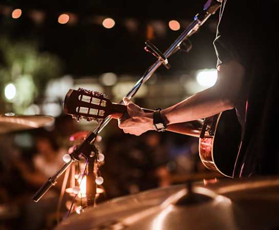person playing a drum set at night at Glenn Perimeter, Atlanta, 30328