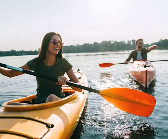 a couple kayaking on a lake at The Brittany, Indialantic, FL, 32903