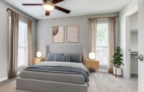 the master bedroom has a comfy bed and a ceiling fan