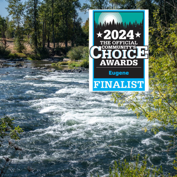 a river with a sign that says the official confluence choice awards finalist