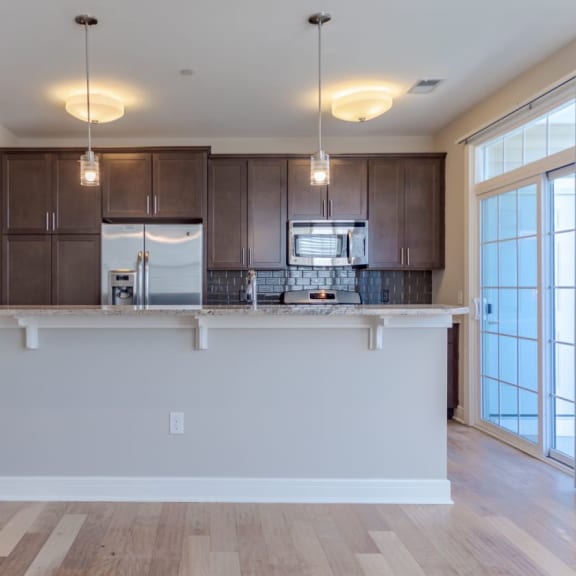 a kitchen with a counter top in a living room