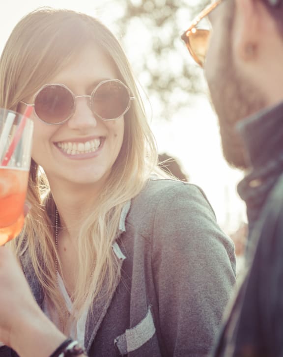 a man and a woman holding a glass of wine