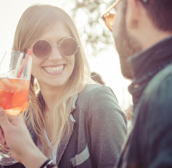 a man and a woman holding a glass of wine