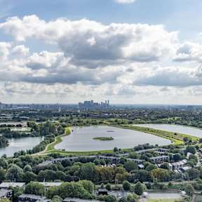 Aerial view of Walthamstow Wetlands reservoirs and green space near Ferry Island.