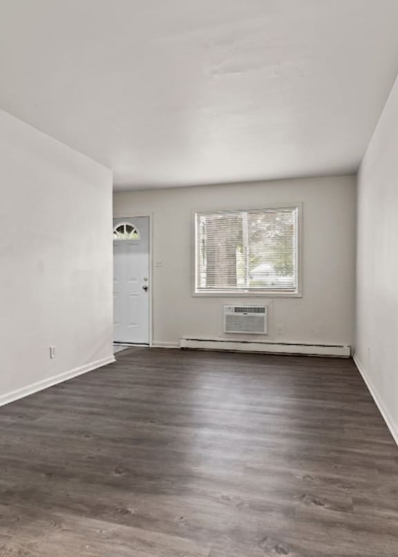 A room with a door and a window.