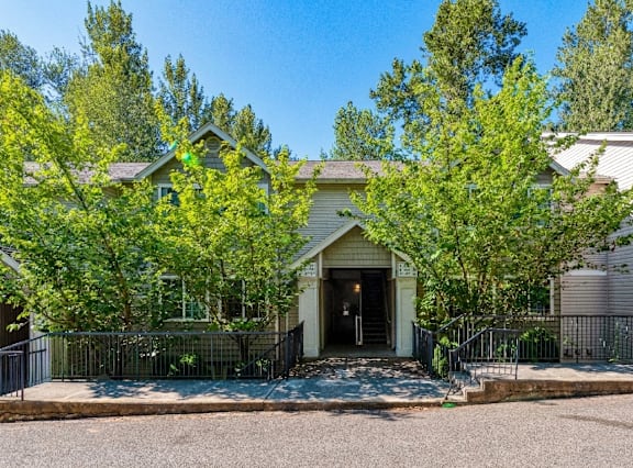 A house with a front yard and trees.