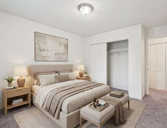 A bedroom with a large bed and a painting on the wall.