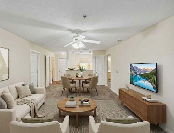 Living Room with ceiling fan and TV at Columbia Colony Senior, Atlanta, GA