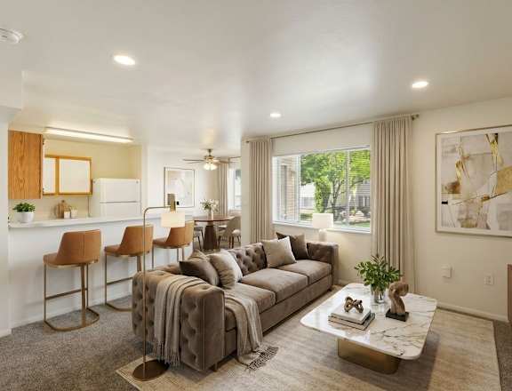 A living room with a couch, chairs, and a coffee table.