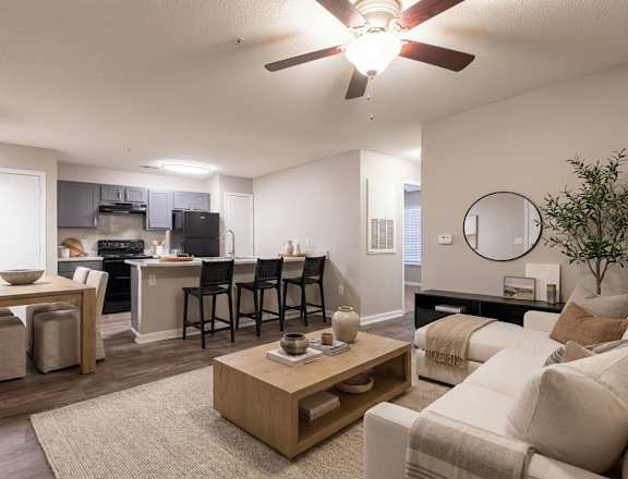 A living room with a dining table and chairs.