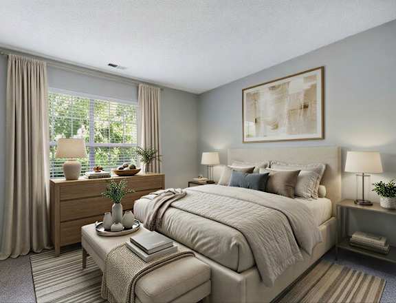 A bedroom with a bed, nightstands, and a ceiling fan.