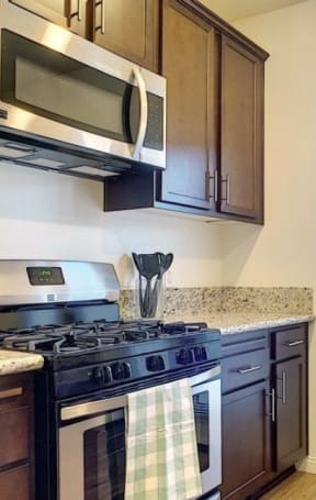 a kitchen with a stove and a glass door