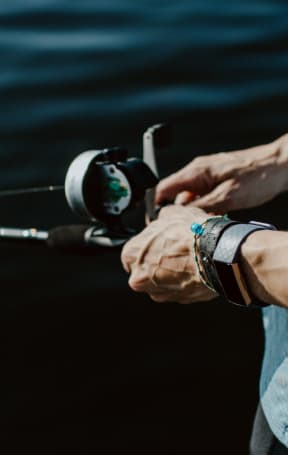 Man Holding Fishing Rod