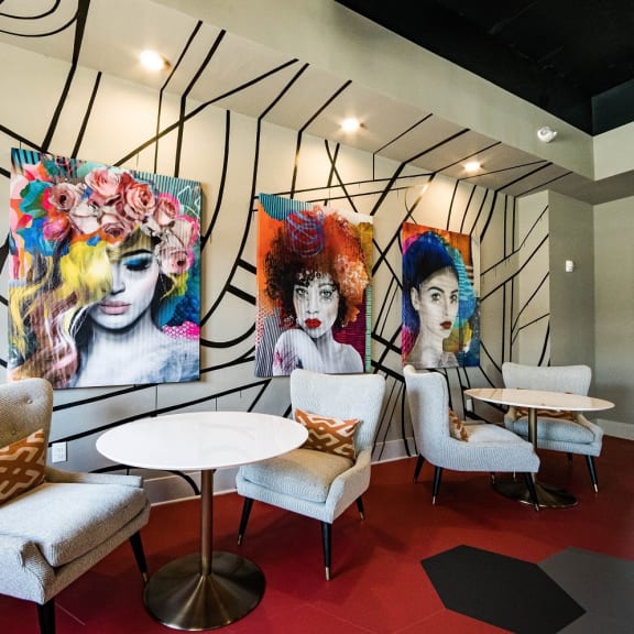 a room with three paintings on the wall  at The Collective NoDa, Charlotte, 28205