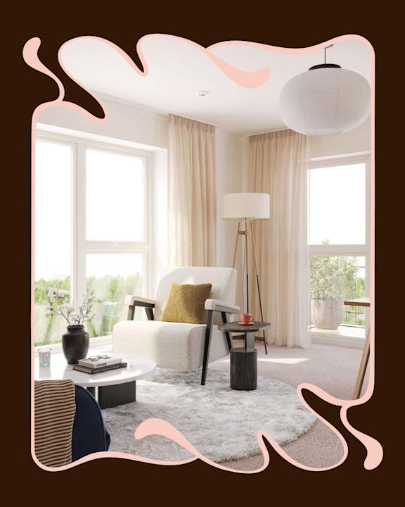 A living room with a white sofa at Fernlow Apartments, Houghton Regis