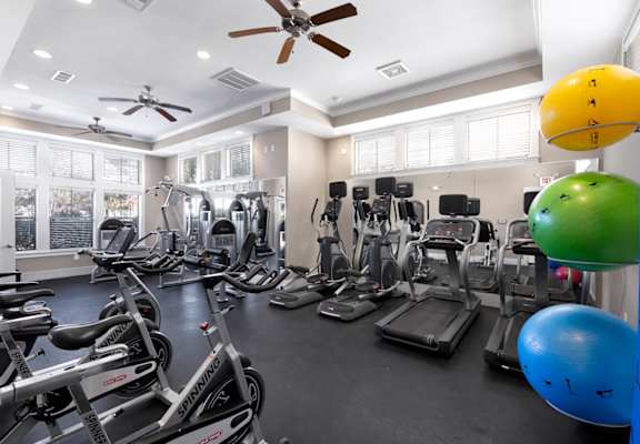 a room filled with lots of different types of exercise equipment