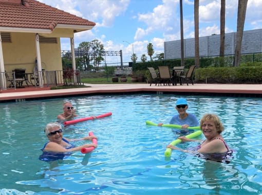 Residents Enjoy the Outdoor Pool at Elison Independent Living of Lake Worth