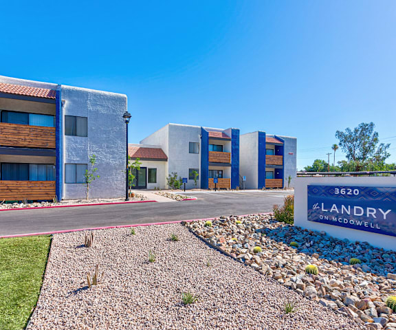 A sign that says Landry in front of some buildings.