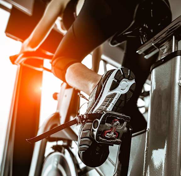 A person is exercising on a stationary bike.