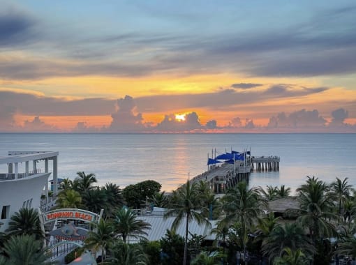 the sun sets over the ocean at the margaritaville resort in punta can