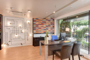 Leasing Office with Work Desks, Computer Monitors, Hardwood Inspired Floors and Window