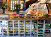 Thumbnail 8 of 8 - A bookstore with a sign that reads "Palate" and a display of books in the window.