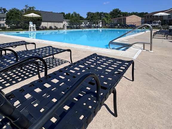 A pool with a blue sky in the background.