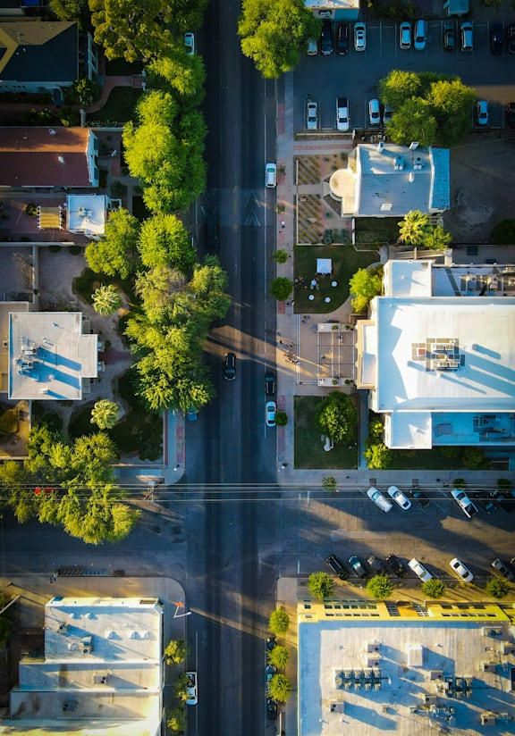 Aerial View of Buildings and City Streets Lined with Trees
