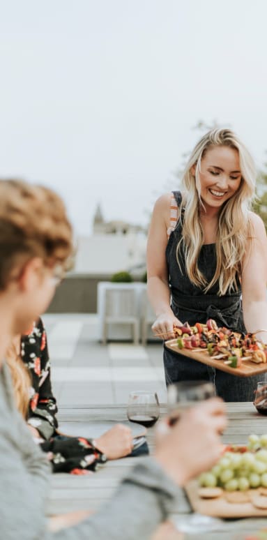 Woman And Rooftop Grill at Residences at Richmond Trust, Richmond