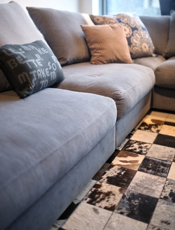 a couch with pillows on it in a living room