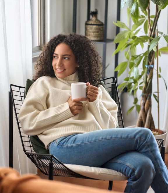 Woman having coffee at Cypress River, Ladson, 29456