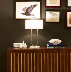 a table with a lamp on top of it  at 888 Hilgard – Furnished Apartments, Los Angeles, CA