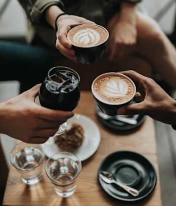 Friends Having Wine and Coffee