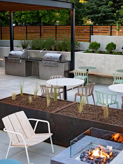 The Gabe Apartments in Portland, Oregon Patio with BBQ Grills and Fire Pit