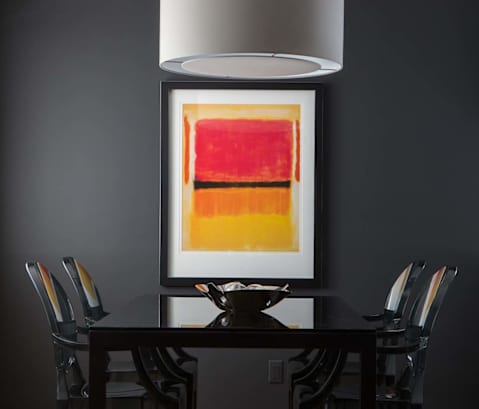 a painting hangs above the table in the dining room  at 888 Hilgard – Furnished Apartments, Los Angeles, CA