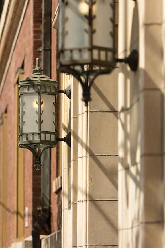 A street lamp is mounted on a building.