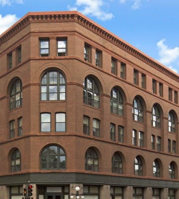a large brick building on a city street