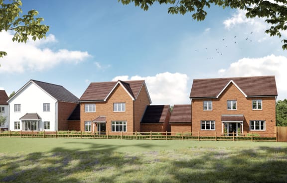 a row of houses in front of a green field