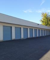 A long row of garage doors are closed.